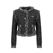 Black textured jacket with decorative buttons and fringes on a white background
