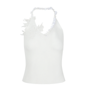 White halter top with ruffled details on a white background